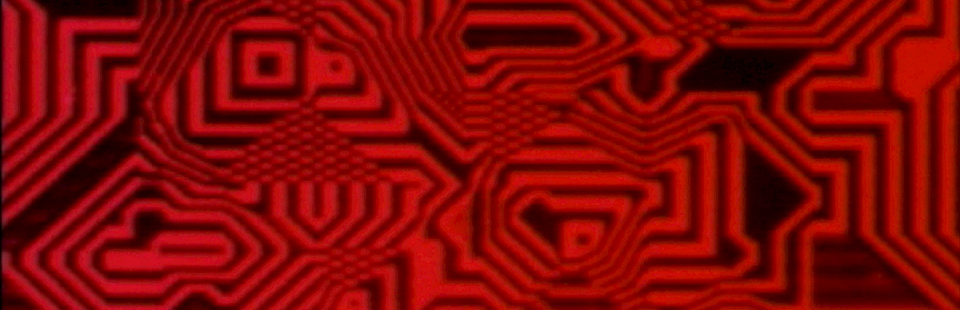 Still from 'Pixillation' by Lillian Schwartz depicting interlocking geometric patterns in red and black.