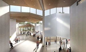 Interior rendering of the Museum's Atrium showing the Park Entrance from the south, the Museum Store, and the entrance to the Windgate Art School. There is a light wood ceiling with high clerestory windows.