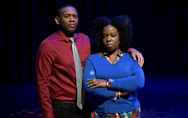 Photo of two actors from Breaking the Box posed in front of a black background.