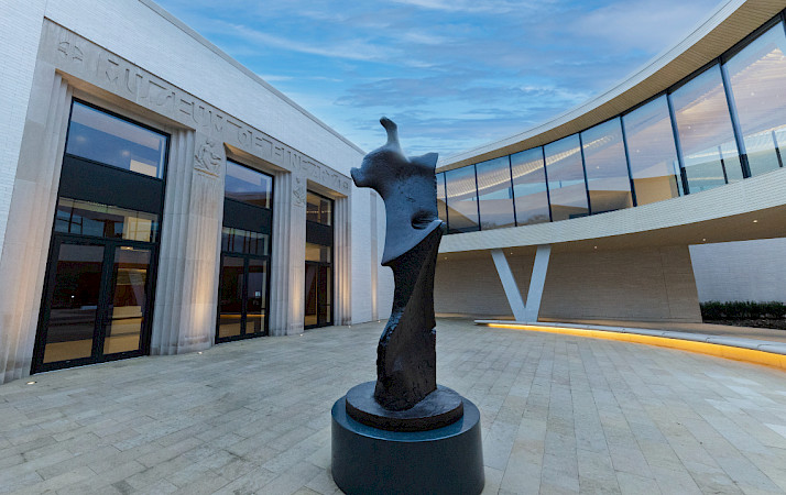 Photo of a bronze sculpture in a courtyard at the Arkansas Museum of Fine Arts.