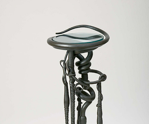 Albert Paley (Philadelphia, Pennsylvania, 1944 - ), "Plant Stand," 1983, forged and fabricated mild steel and glass, 47 1/4 × 16 1/2 × 16 1/2 in., Arkansas Museum of Fine Arts Foundation Collection: Purchase, Decorative Arts Museum Fund. Photography by Edward C. Robison III.