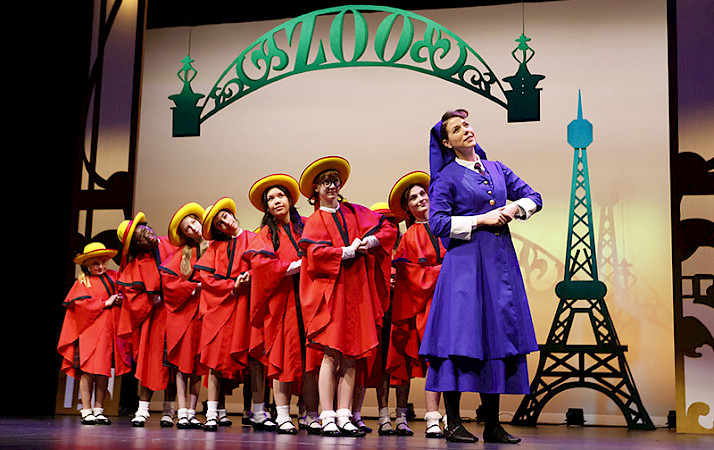 Photo of the cast of Madelines Christmas on stage during a scene.