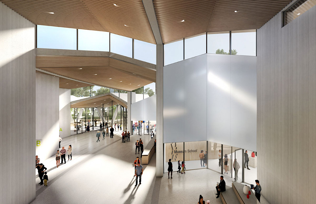 View of MacArthur Park From the Atrium: The Atrium connects visitors to the Museum Store, Windgate Art School, Harriet and Warren Stephens Galleries, Governor Winthrop Rockefeller Lecture Hall, and Performing Arts Theater. Image courtesy of Studio Gang.