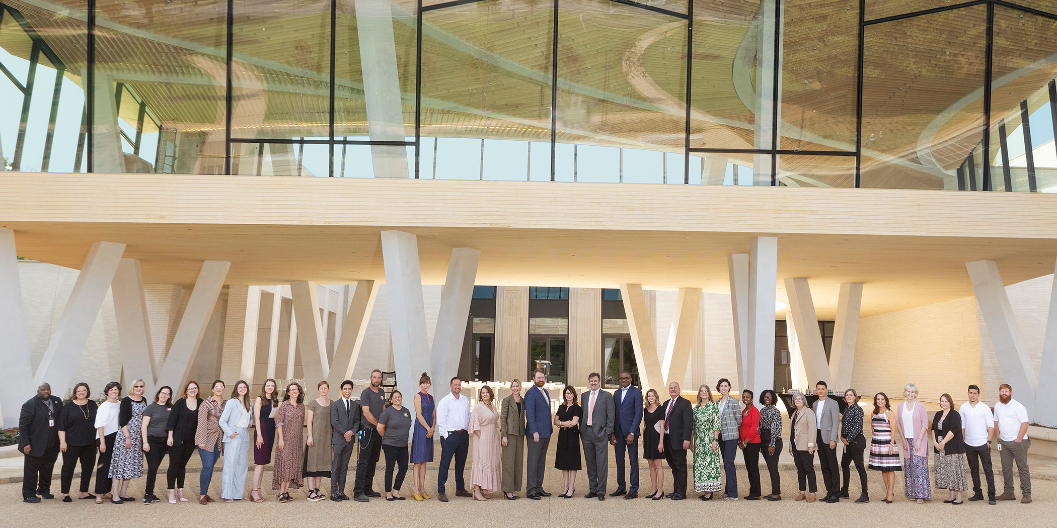 Photo of the AMFA staff standing in front of the Courtyard Entrance to the Museum.