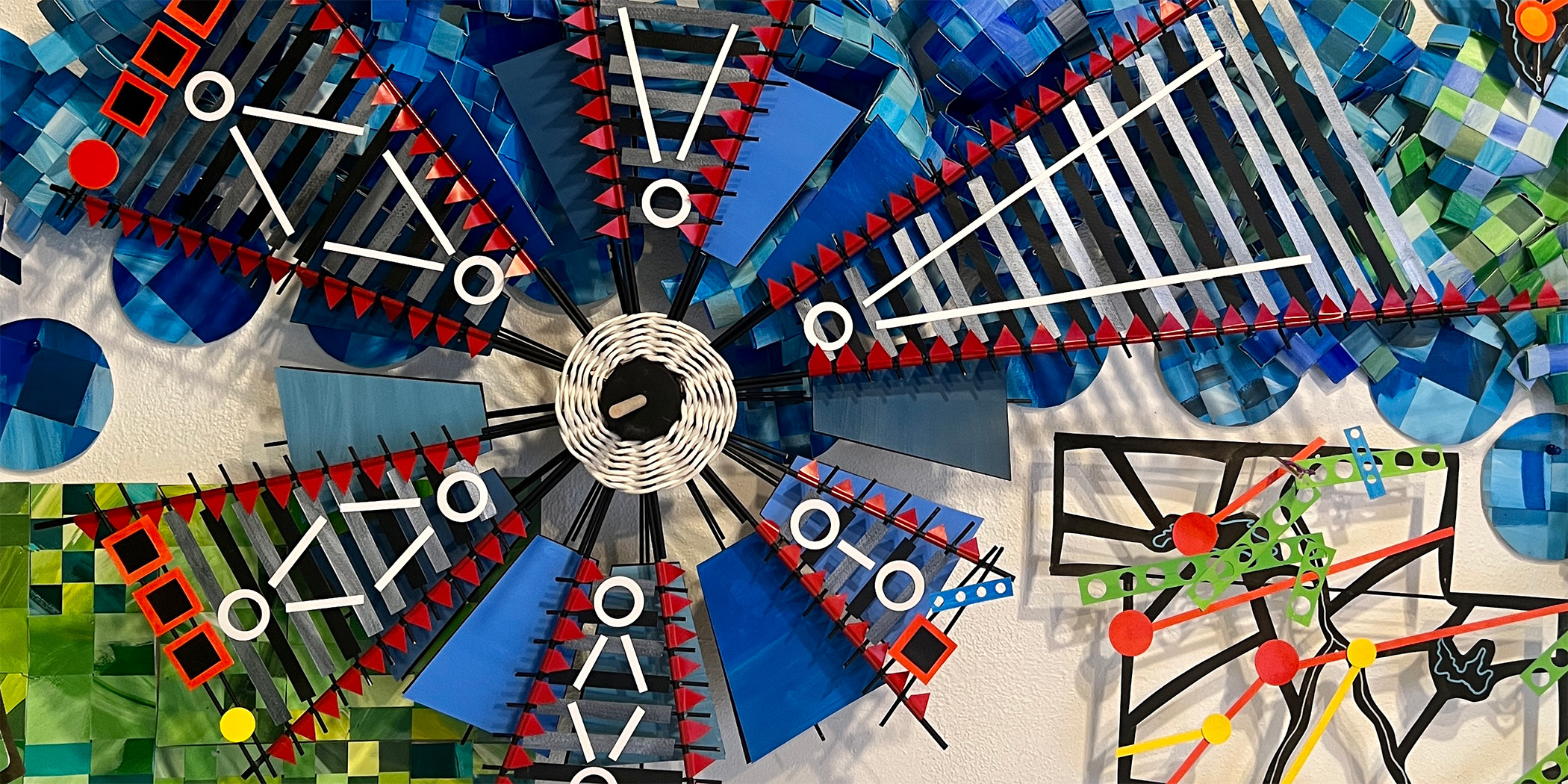 Detail photo of a three-dimensional art installation make of handcut paper.