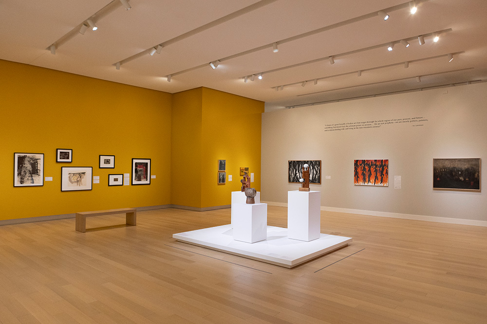Photo of a gallery at the Arkansas Museum of Fine Arts displaying modern Native American art.