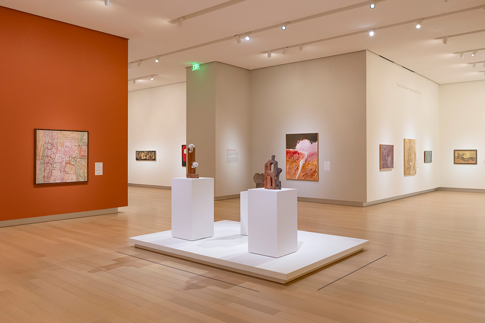 Photo of a gallery at the Arkansas Museum of Fine Arts displaying modern Native American art.