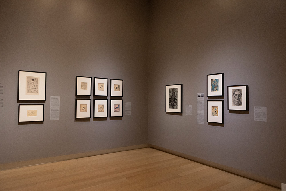 Photo of an art gallery at the Arkansas Museum of Fine Arts displaying framed Cubist paintings.