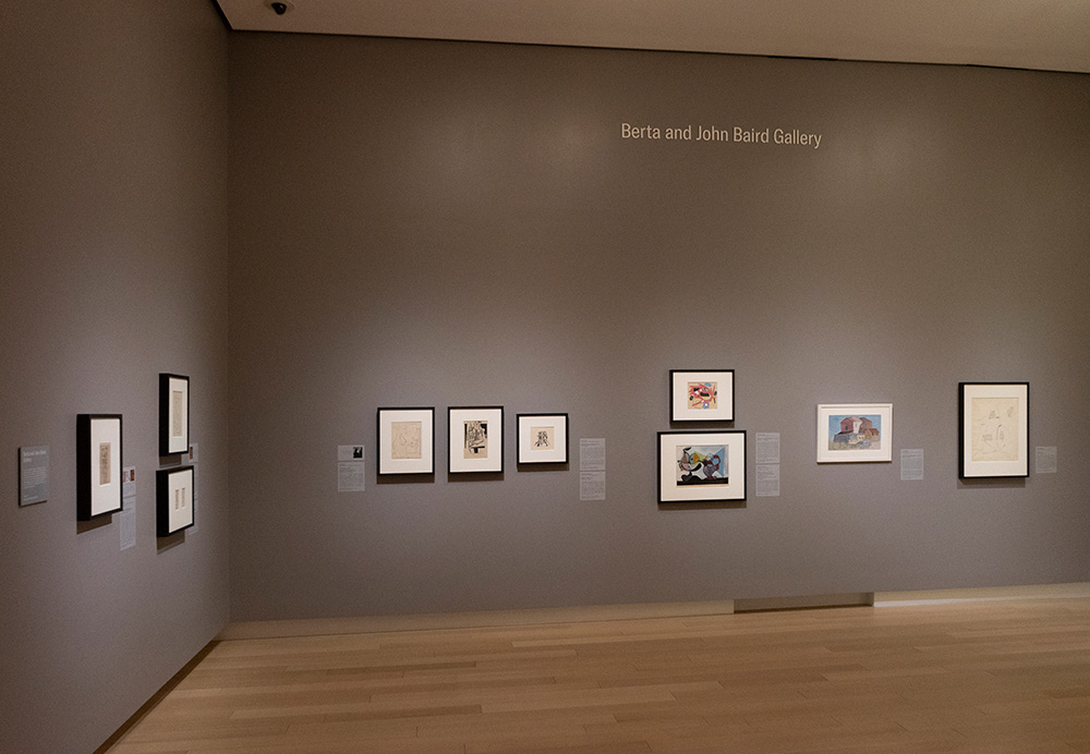 Photo of an art gallery at the Arkansas Museum of Fine Arts displaying framed Cubist paintings.