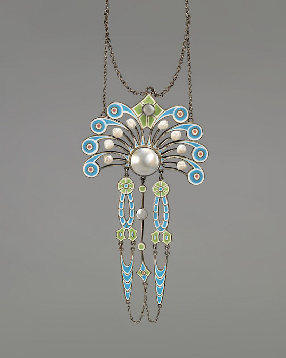 Detail photo of a necklace with danging blue and green beads with pearl inlays.