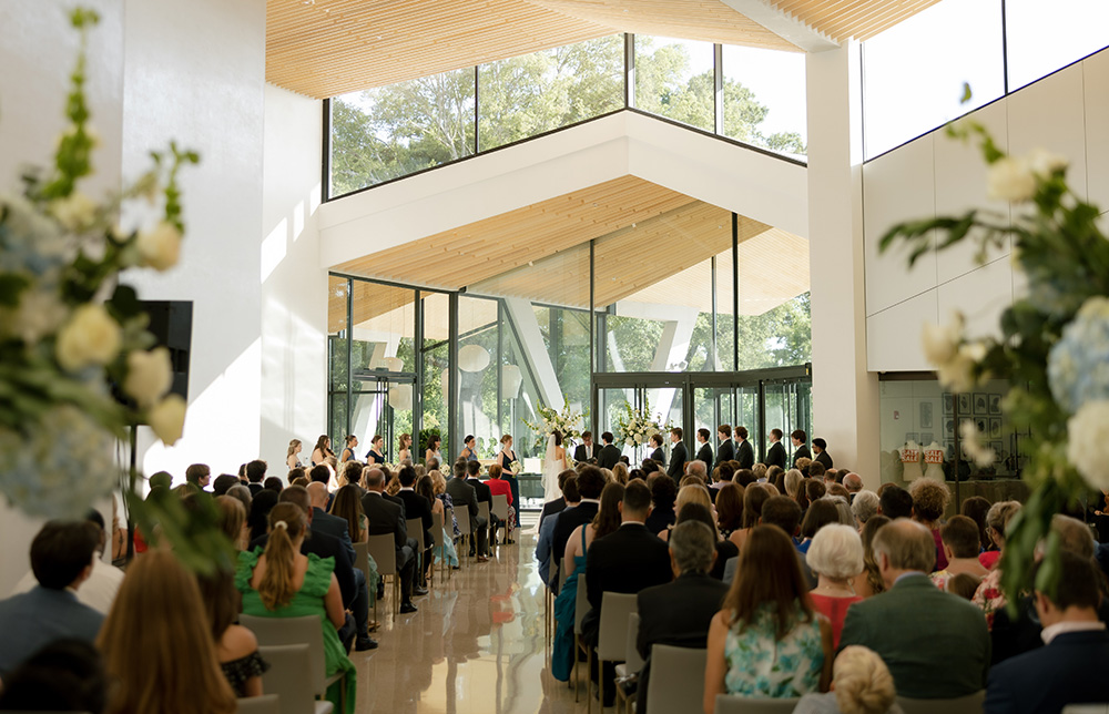 Photo of a wedding taking place inside the Atrium at the Arkansas Museum of Fine Arts.