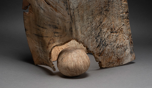 Detail photo of an abstract wooden sculpture by Michael Peterson.
