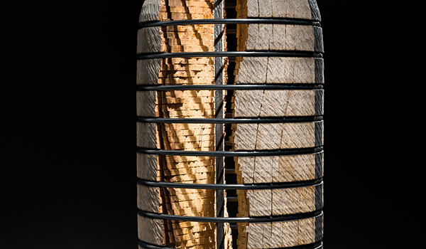 Detail photo of an abstract oak and steel sculpture by Todd Hoyer.