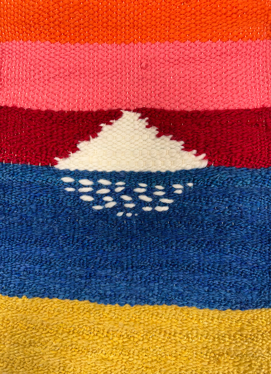 Photo of a weaving with brightly-colored stripes.
