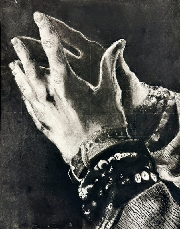 Charcoal drawing of two hands with several bracelets on the wrists.