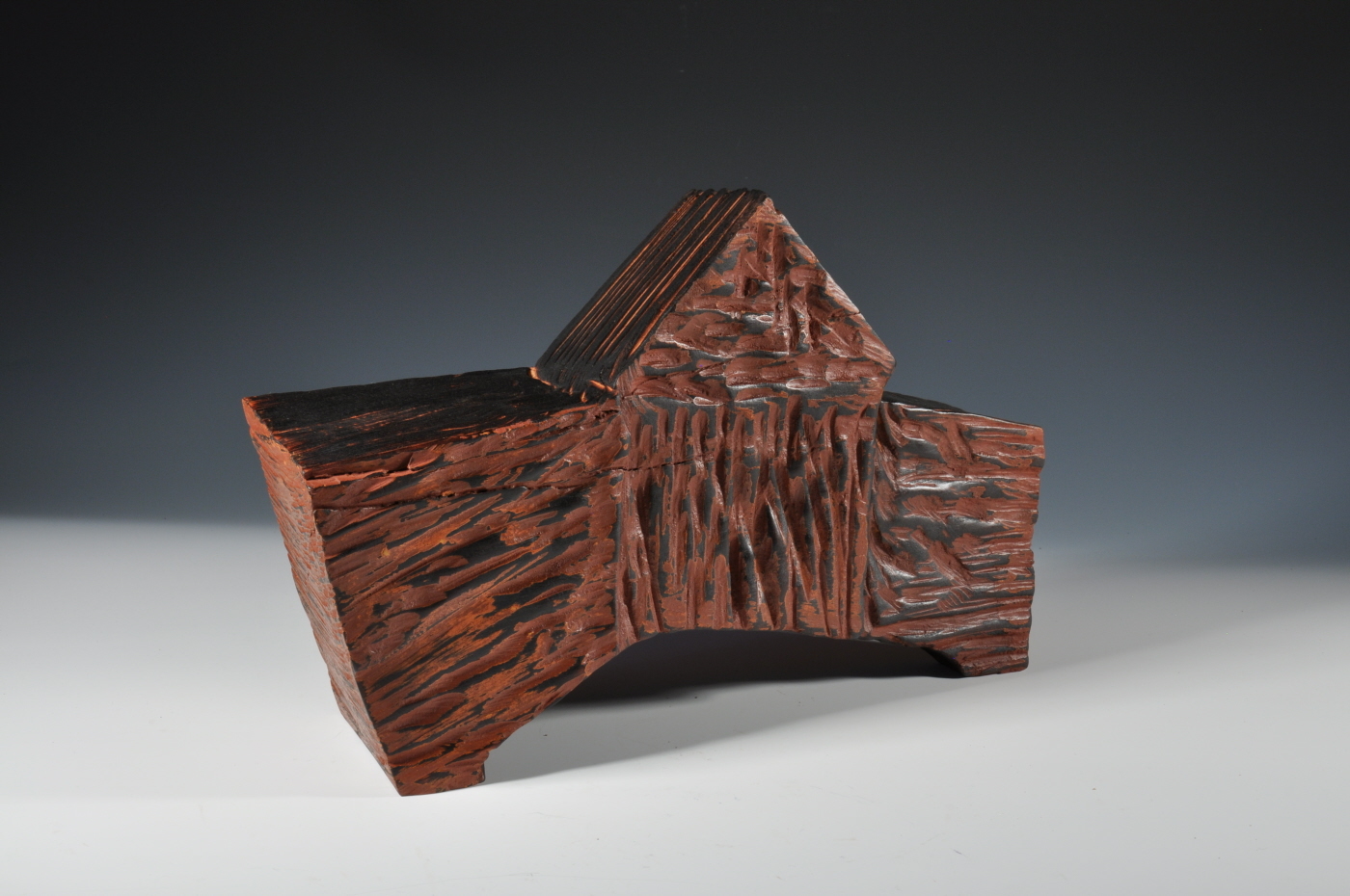 Photo of an abstract wooden sculpture.