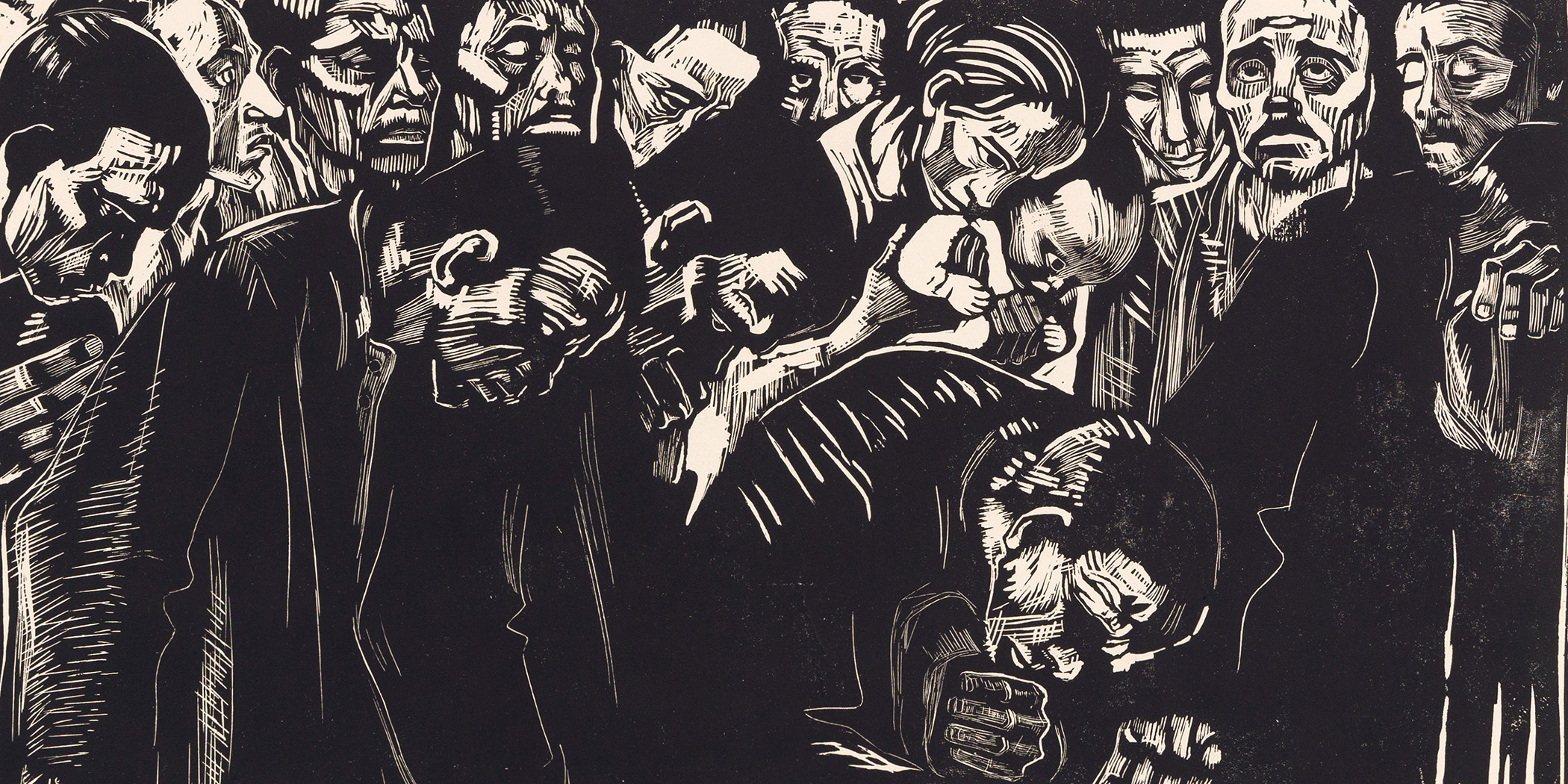 Photo of a black and white woodcut print by Kathe Kollwitz depicting a group of people mourning over a body.
